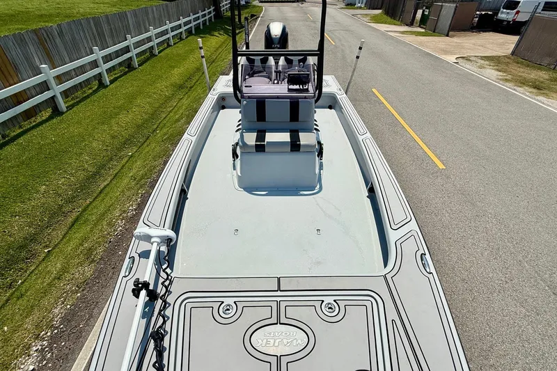Slide: The Image of 2017 Majek M2 ILLUSION boat on road, showcasing deck and seating. - 14