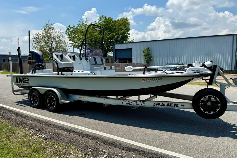 Slide: The Image of 2017 Majek M2 ILLUSION boat on trailer, parked on roadside under clear sky. - 5