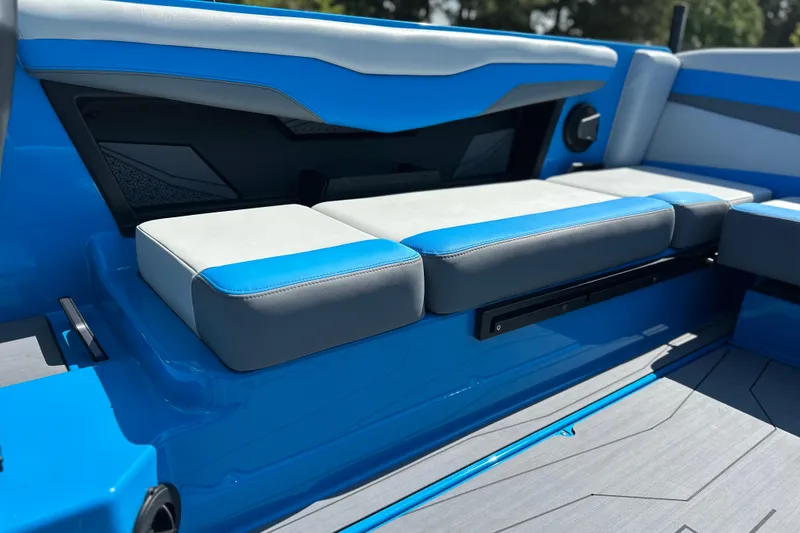 Slide: The Image of 2026 Axis T235 boat interior with blue and gray seating, modern design. - 11