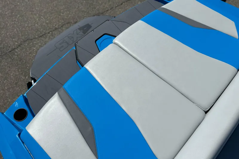 Slide: The Image of 2026 Axis T235 boat with blue and gray seating, sleek modern design. - 17