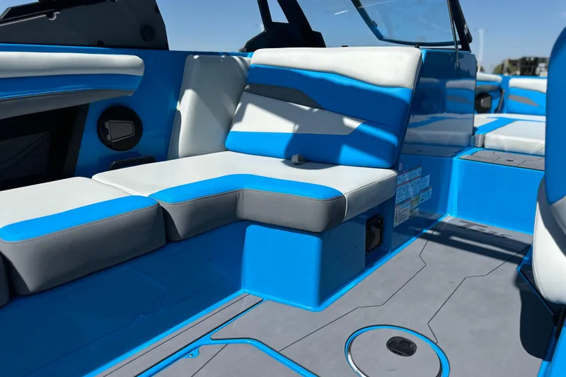 Slide: The Image of 2026 Axis T235 boat interior with blue and gray seating, modern design. - 8
