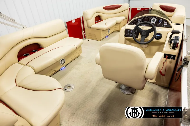 Slide: The Image of 2017 Sylvan 818 Mirage CR boat interior with beige seating and modern dashboard. - 12