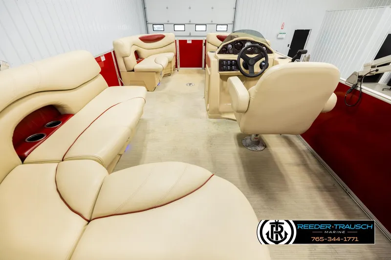 Slide: The Image of Luxurious interior of 2017 Sylvan 818 Mirage CR pontoon boat with beige seating and red accents. - 16