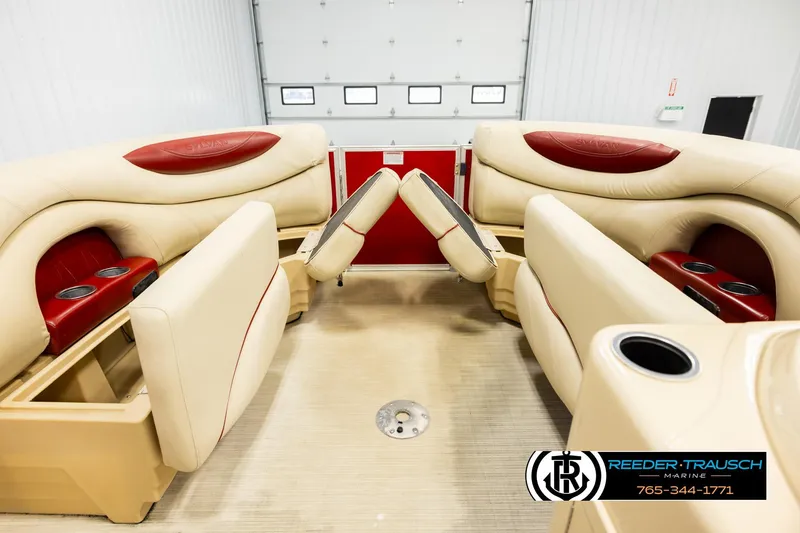 Slide: The Image of 2017 Sylvan 818 Mirage CR boat interior with beige and red seating, cup holders. - 20