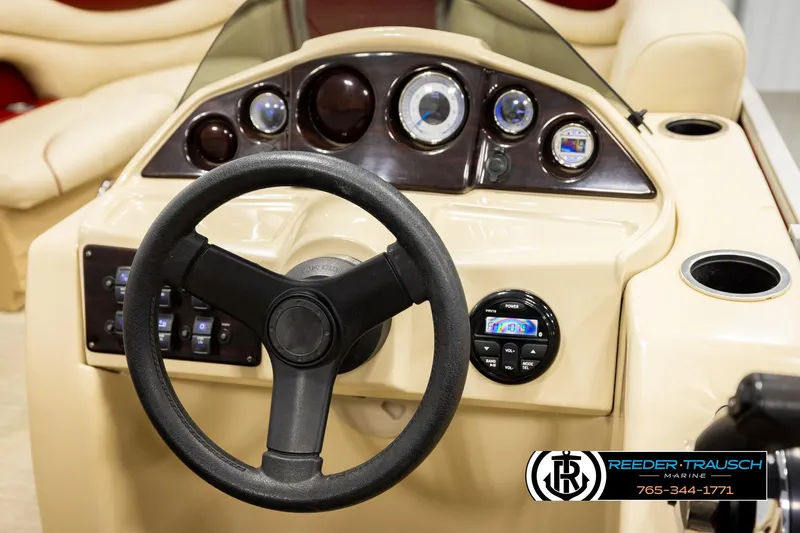 Slide: The Image of Steering console of 2017 Sylvan 818 Mirage CR boat with gauges and controls. - 24