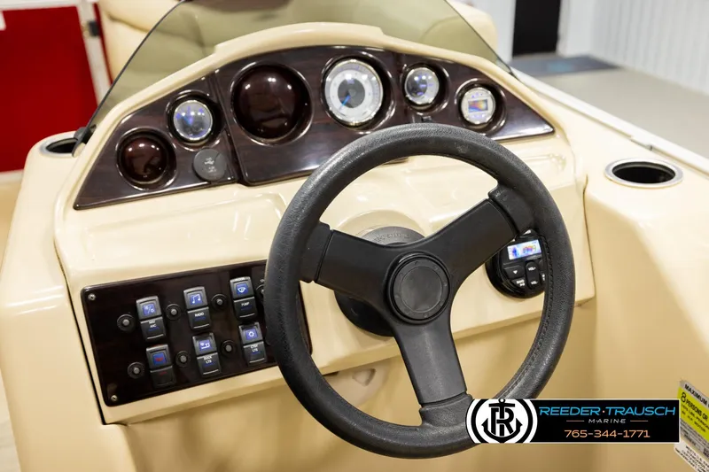 Slide: The Image of Steering console of 2017 Sylvan 818 Mirage CR boat with gauges and controls. - 25