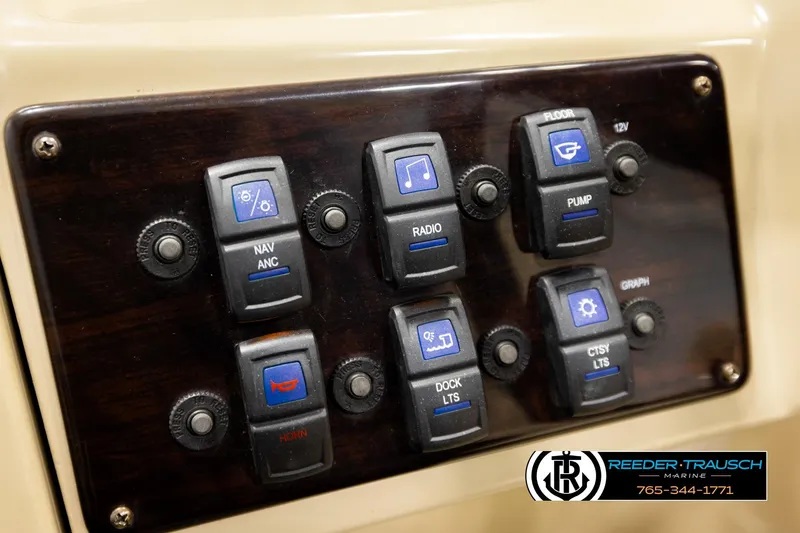 Slide: The Image of Control panel of 2017 Sylvan 818 Mirage CR boat with labeled switches. - 26