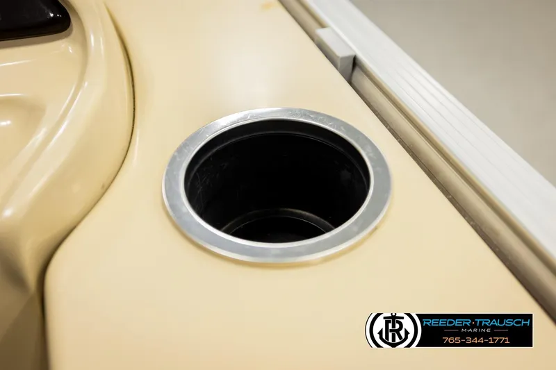 Slide: The Image of Cup holder on 2017 Sylvan 818 Mirage CR boat, beige interior, Reeder-Trausch Marine logo. - 29
