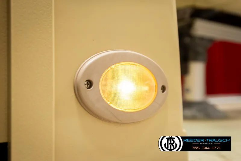 Slide: The Image of Close-up of a 2017 Sylvan 818 Mirage CR boat light with Reeder-Trausch Marine logo. - 33