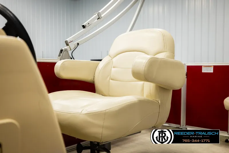 Slide: The Image of Cream leather seat on 2017 Sylvan 818 Mirage CR boat, red panel background. - 34