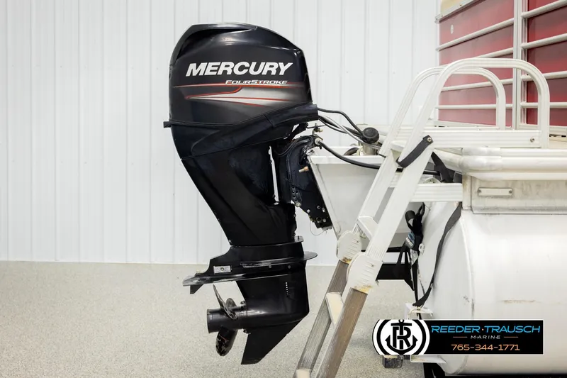 Slide: The Image of 2017 Sylvan 818 Mirage CR with Mercury FourStroke outboard motor, displayed indoors. - 37