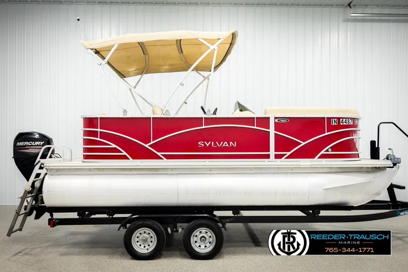 Slide: The Image of 2017 Sylvan 818 Mirage CR pontoon boat with red exterior and canopy on trailer. - 5