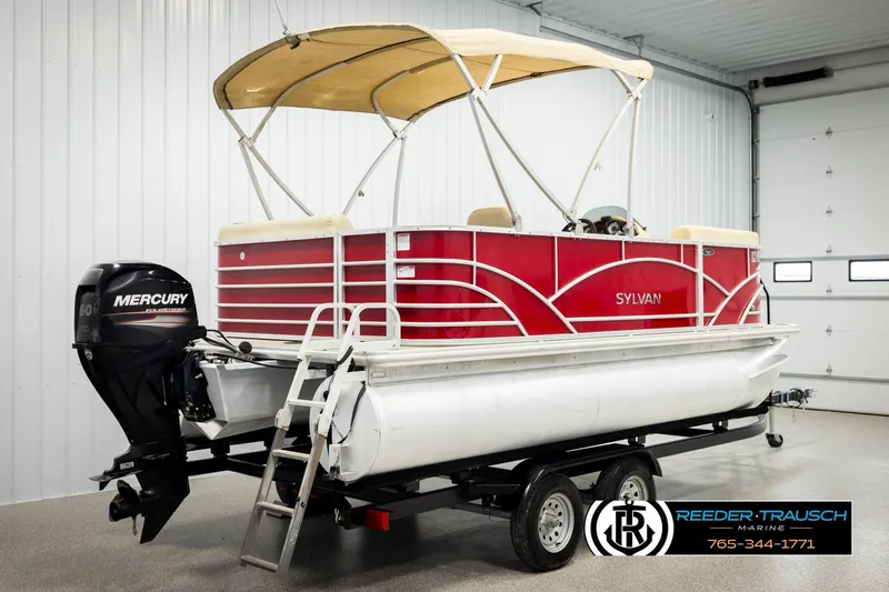 Slide: The Image of 2017 Sylvan 818 Mirage CR pontoon boat with Mercury outboard motor in indoor showroom. - 6