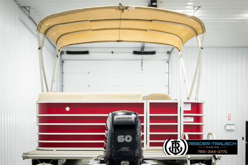 Slide: The Image of 2017 Sylvan 818 Mirage CR pontoon boat with Mercury 60 engine in a showroom. - 7