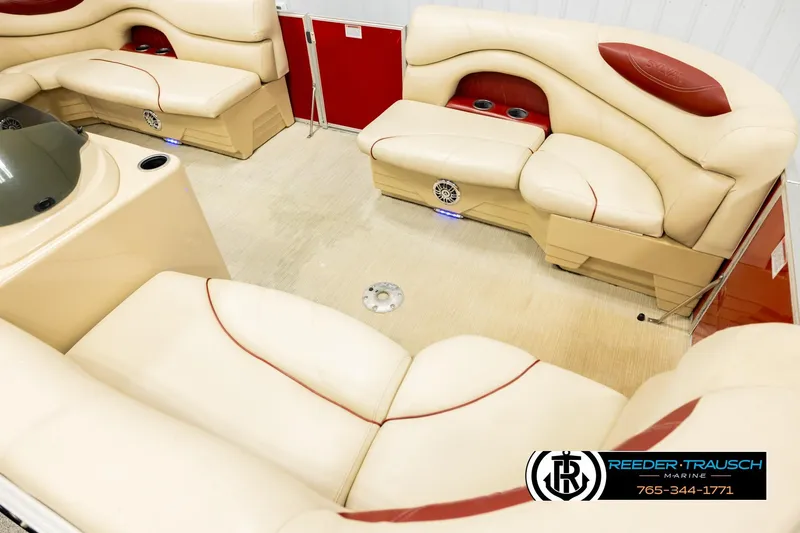 Slide: The Image of Luxurious interior of 2017 Sylvan 818 Mirage CR pontoon boat with cream and red seating. - 9