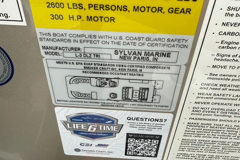 Slide: The Image of Label on Sylvan L-3 DLZ DH boat, 2026 model, showing safety and seating information. - 18