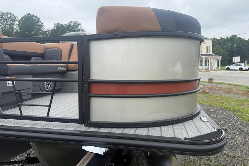 Slide: The Image of 2026 Sylvan L-3 DLZ DH pontoon boat with sleek design and comfortable seating. - 26