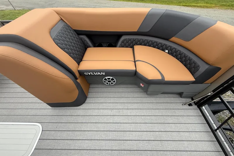 Slide: The Image of Luxurious seating on 2026 Sylvan L-3 DLZ DH pontoon boat, featuring tan and black upholstery. - 9