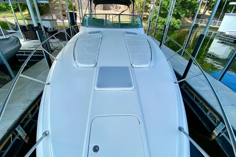 Slide: The Image of 2004 Formula 37 PC yacht docked, showcasing sleek white deck and modern design. - 11