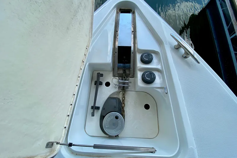 Slide: The Image of Anchor compartment of a 2004 Formula 37 PC boat with chain and controls. - 12