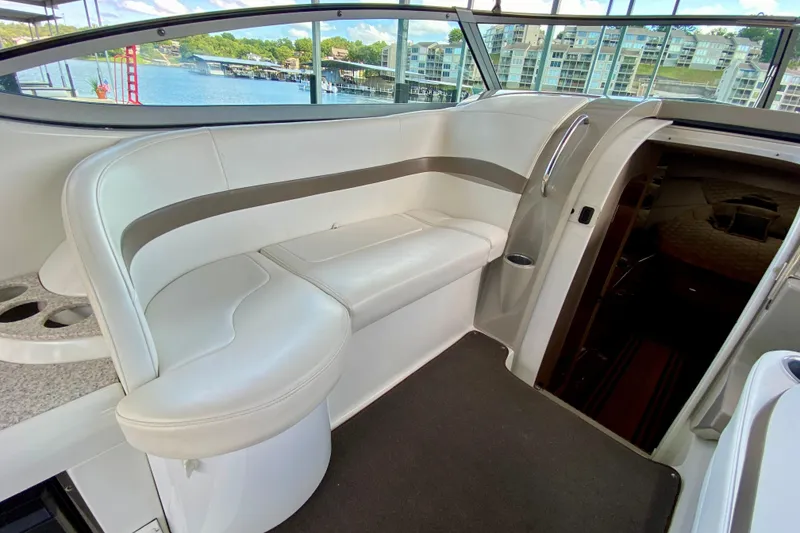 Slide: The Image of 2004 Formula 37 PC yacht interior with white seating and lake view. - 15