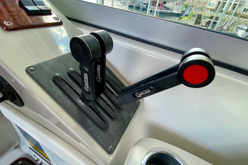 Slide: The Image of Throttle controls on a 2004 Formula 37 PC boat, featuring Gaffrig levers. - 18