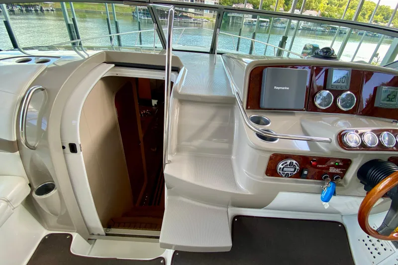 Slide: The Image of 2004 Formula 37 PC yacht cockpit with helm, stairs, and cabin entrance. - 20