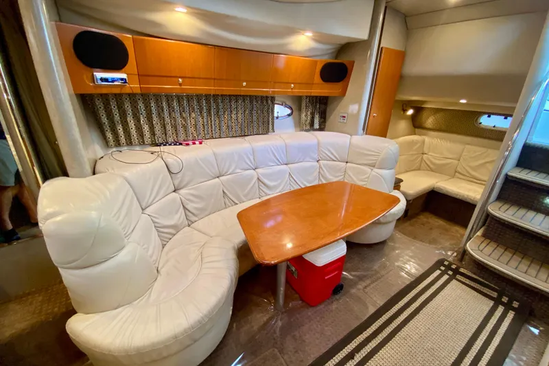Slide: The Image of Luxurious interior of a 2004 Formula 37 PC yacht with plush seating and wooden table. - 25