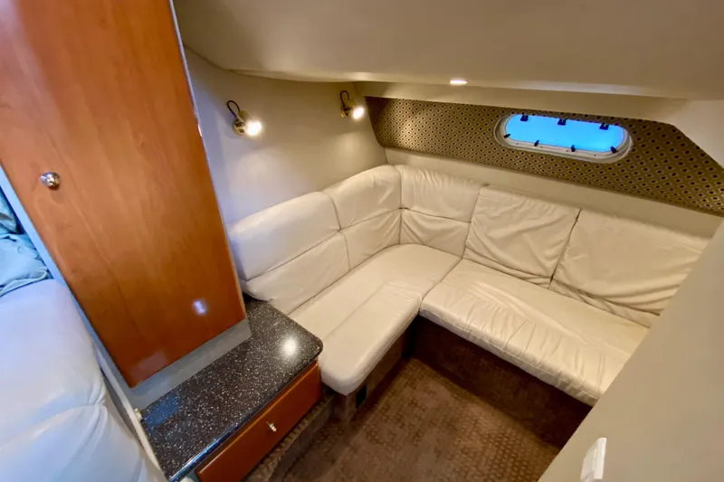 Slide: The Image of Luxurious interior of 2004 Formula 37 PC yacht with white leather seating and wood accents. - 26