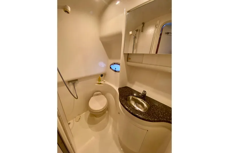 Slide: The Image of 2004 Formula 37 PC yacht bathroom with toilet, sink, and shower. - 29
