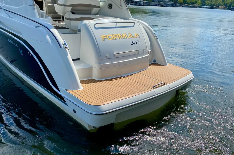 Slide: The Image of 2004 Formula 37 PC yacht with teak swim platform on a sunny lake. - 7