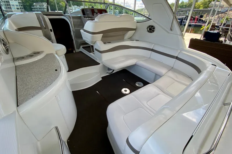 Slide: The Image of 2004 Formula 37 PC yacht interior with white seating and modern dashboard. - 9