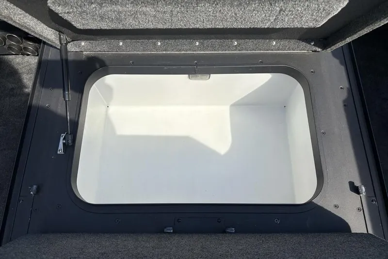 Slide: The Image of Open storage compartment in 2008 Skeeter ZX190 boat, featuring a spacious interior. - 10