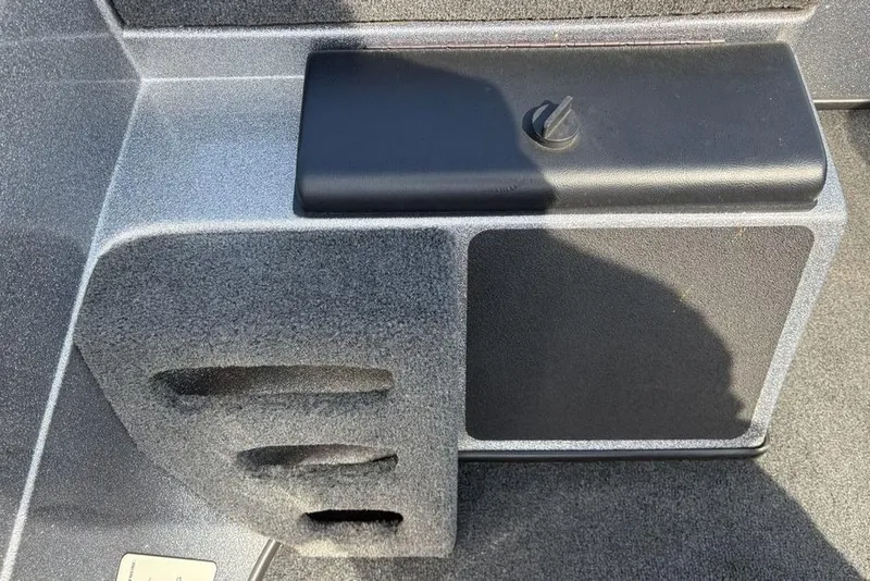 Slide: The Image of 2008 Skeeter ZX190 boat interior detail with storage compartment and textured finish. - 16