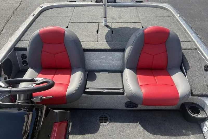 Slide: The Image of 2008 Skeeter ZX190 boat interior with red and gray seats, steering wheel visible. - 17