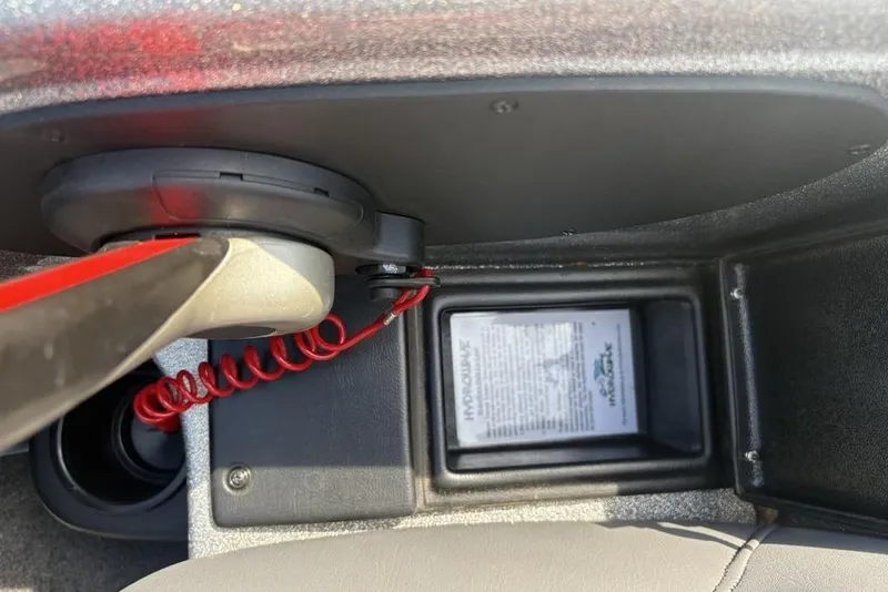 Slide: The Image of 2008 Skeeter ZX190 boat control panel with red coiled cord and instruction label. - 18