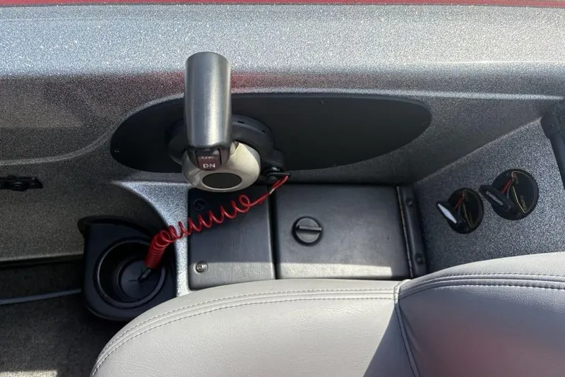 Slide: The Image of 2008 Skeeter ZX190 boat interior with control panel and cup holder. - 20
