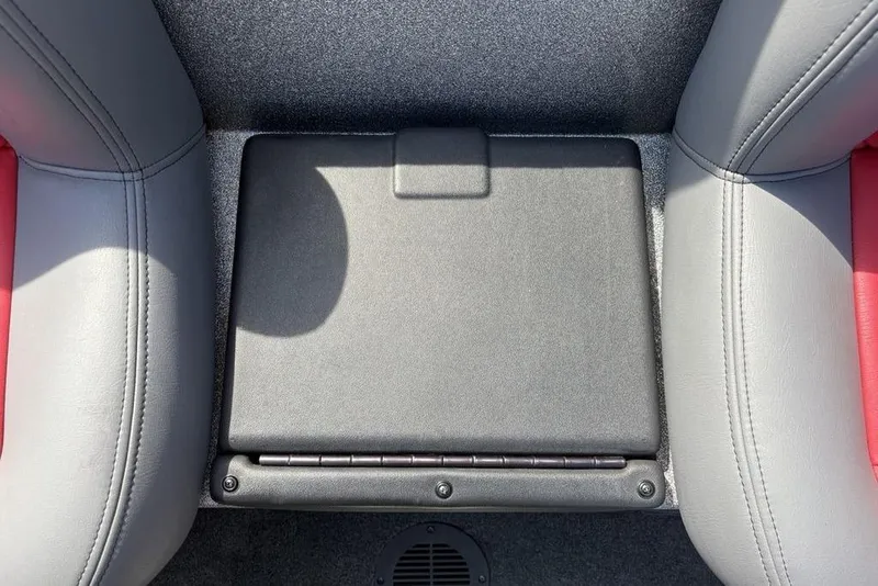 Slide: The Image of 2008 Skeeter ZX190 boat seat with storage compartment, featuring gray and red upholstery. - 25