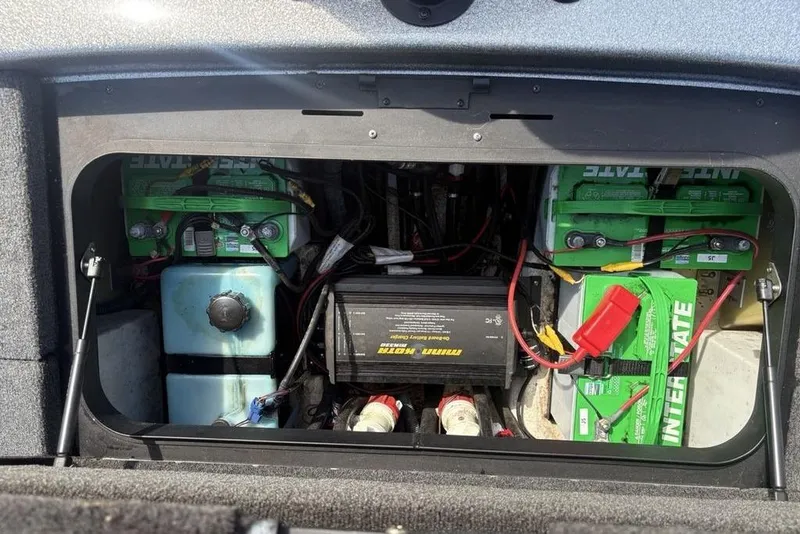 Slide: The Image of 2008 Skeeter ZX190 boat battery compartment with Interstate batteries and Minn Kota charger. - 27