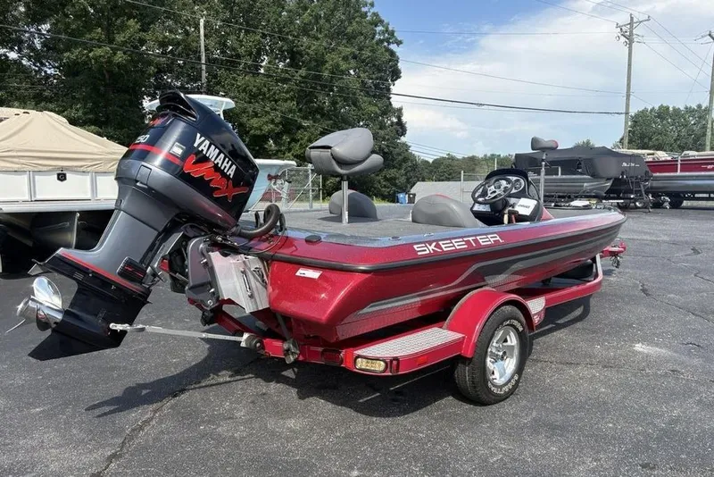 Slide: The Image of 2008 Skeeter ZX190 boat with Yamaha VMAX engine, parked outdoors. - 4
