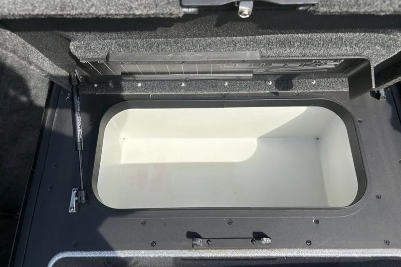 Slide: The Image of Open storage compartment in a 2008 Skeeter ZX190 boat, featuring a spacious interior. - 6