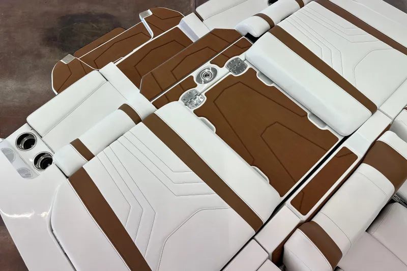 Slide: The Image of 2026 Malibu Wakesetter 25 LSV interior with white and brown upholstery design. - 11