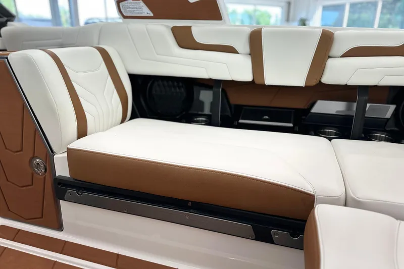 Slide: The Image of 2026 Malibu Wakesetter 25 LSV interior with white and brown seating. - 14