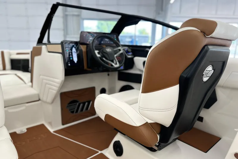 Slide: The Image of 2026 Malibu Wakesetter 25 LSV interior with modern dashboard and luxurious seating. - 16