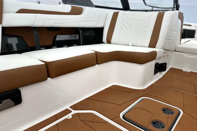 Slide: The Image of 2026 Malibu Wakesetter 25 LSV interior with white and brown seating, modern design. - 17