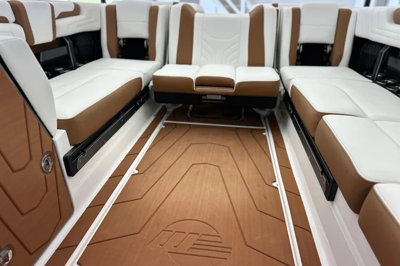 Slide: The Image of 2026 Malibu Wakesetter 25 LSV interior with luxurious white and brown seating. - 24