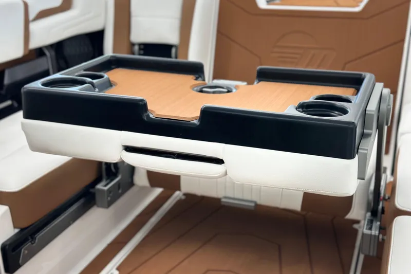 Slide: The Image of 2026 Malibu Wakesetter 25 LSV interior with foldable table and cup holders. - 26
