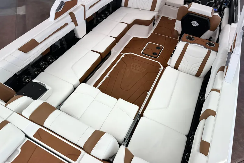 Slide: The Image of 2026 Malibu Wakesetter 25 LSV interior with luxurious white and brown seating. - 30