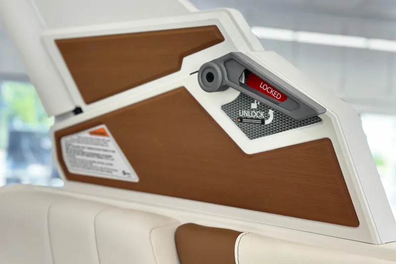 Slide: The Image of 2026 Malibu Wakesetter 25 LSV interior detail with lock mechanism and wood paneling. - 31