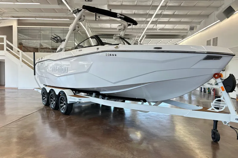 Slide: The Image of 2026 Malibu Wakesetter 25 LSV boat on trailer in showroom. - 5